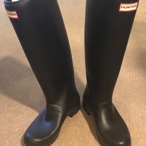 Hunter boots with teal socks.